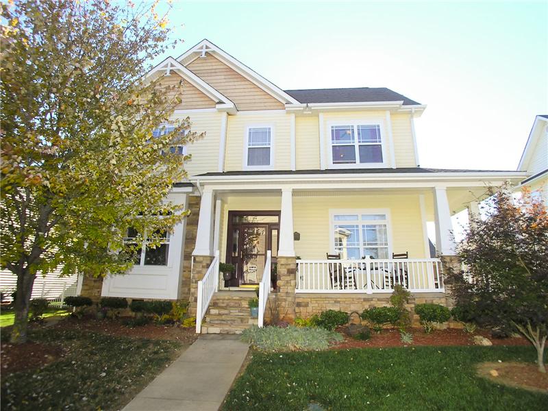 Two-story home with stone accents