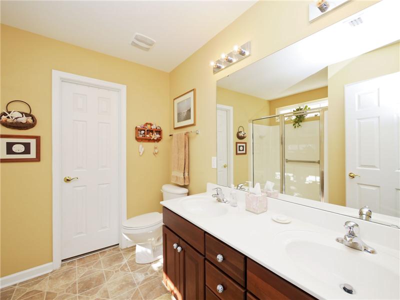 Double sinks and walk-in closet in master bath