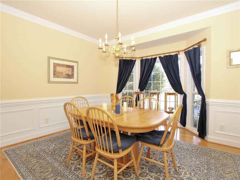 Formal dining room with bay window