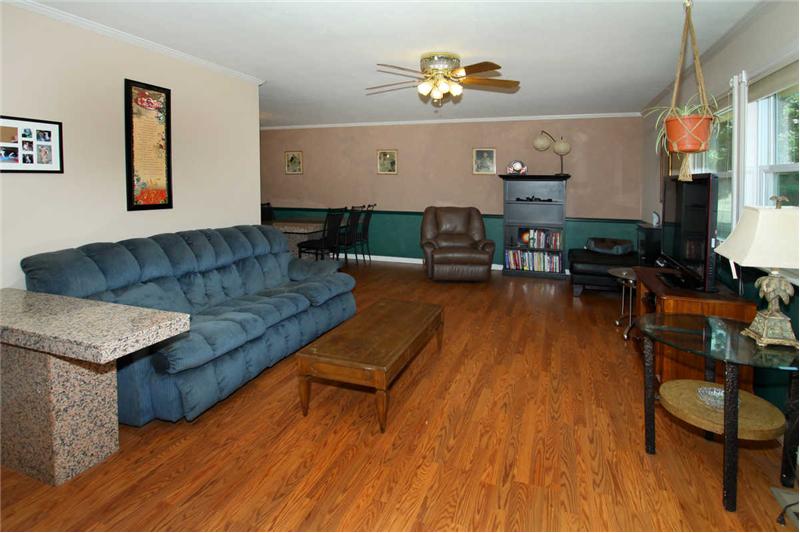 Main level living room with wood laminate flooring