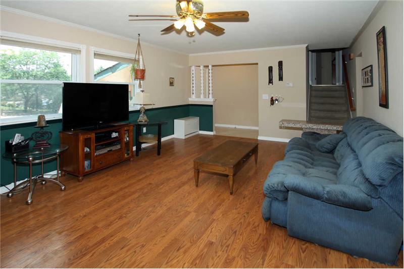 Second view of living room with ceiling fan