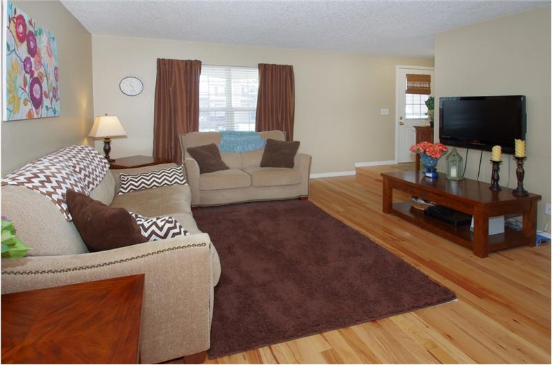 Living room with hickory hardwood flooring.