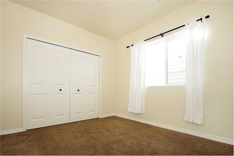 Basement bedroom with large closet.