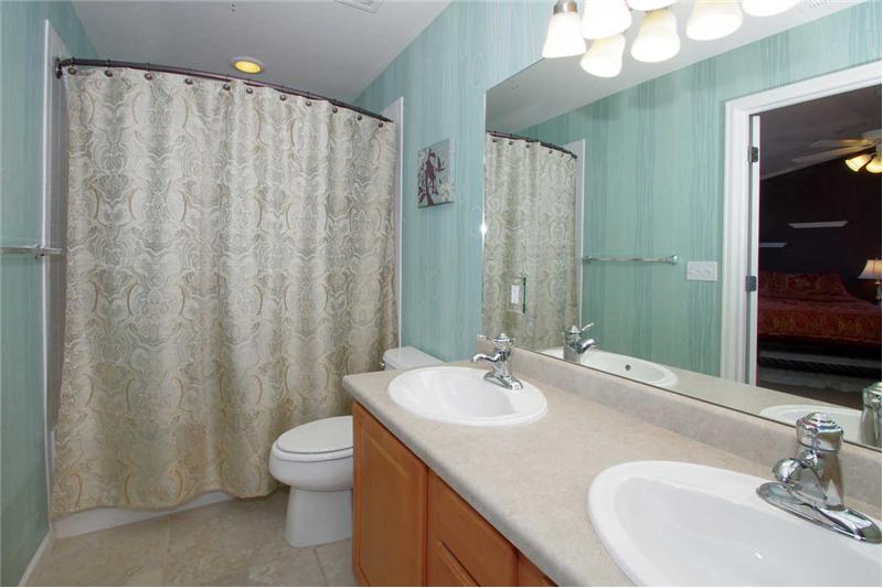 Double sinks, soaking tub, and walk-in closet