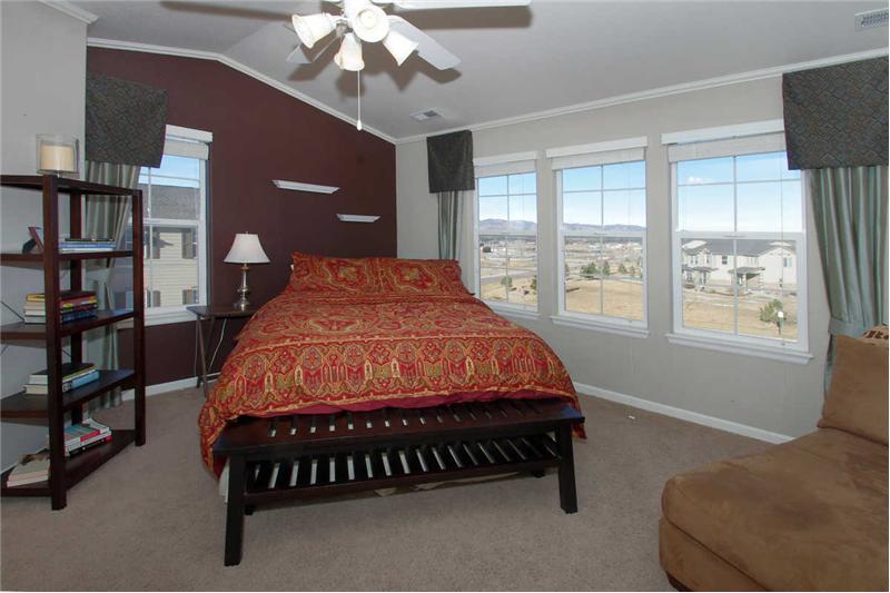 One of two double master suites on upper level with vaulted ceilings and crown molding.