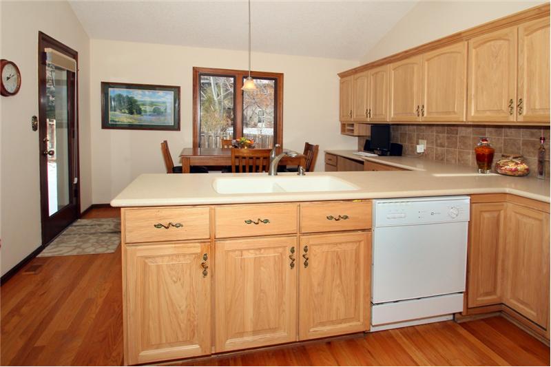 View of breakfast nook with walk out to covered patio