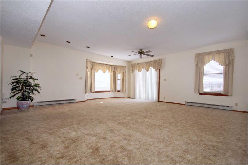 Bonus room adjacent to the family room with recessed lights, bay window, and walk out to backyard.  Plumbed for wet bar!