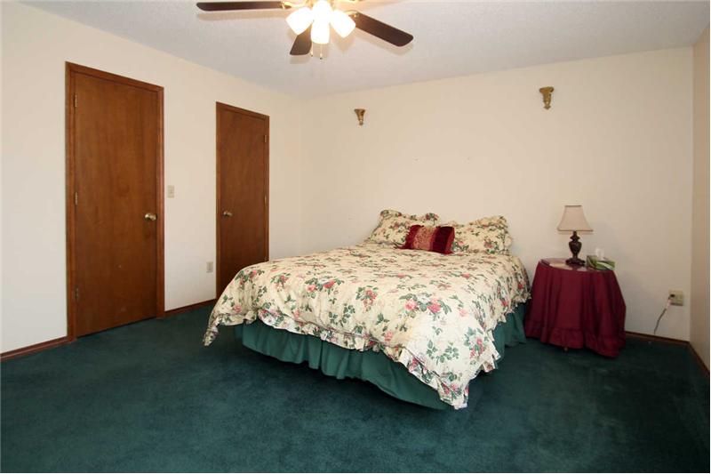 Second master with his and her closets, adjoining 3/4 bath with skylight