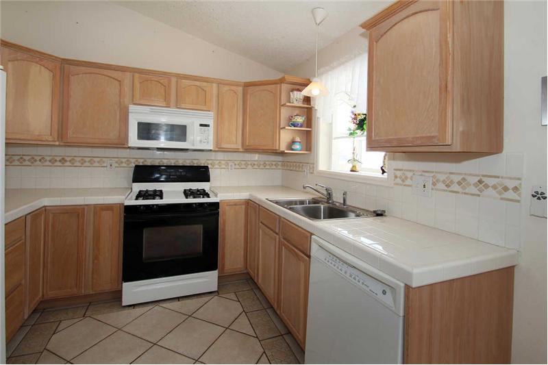Updated kitchen with gas stove and abundant storage