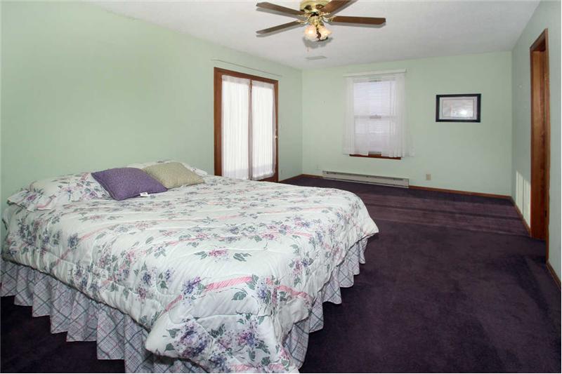 Master bedroom with walk out to private deck w/Peak views, built in speakers, adjoining 4-piece bath, and walk-in closet.