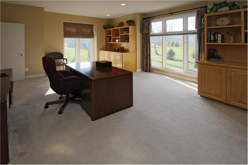 Study: Private office with built-in cabinets.