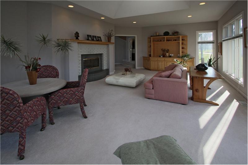 Sun Room: 2-sided fireplace shared with the great room.
