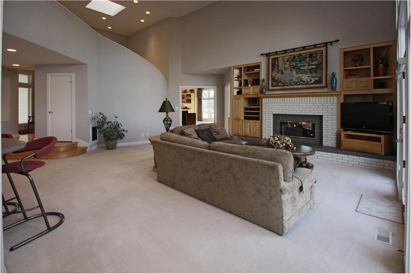 Great Room: Cozy fireplace and built-ins complete the great room.