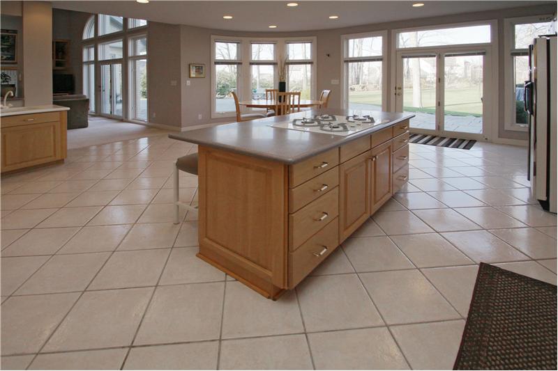 Kitchen: Wall of windows and access to back patio offers plenty of enjoyable views from kitchen and nook.