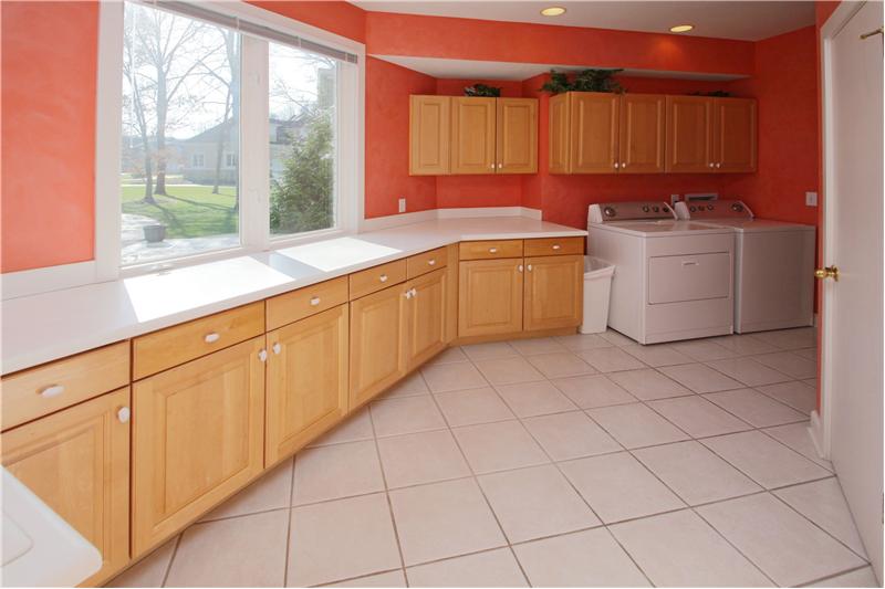 Laundry Room: Amazing laundry room with ample counter and cabinet space.
