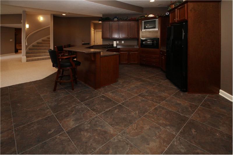 Basement: Wet bar with refrigerator, microwave and television.