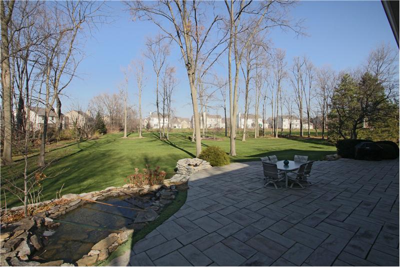 Patio: Large patio in back with koi pond/waterfall, firepit, gas line to grill and outdoor speakers.