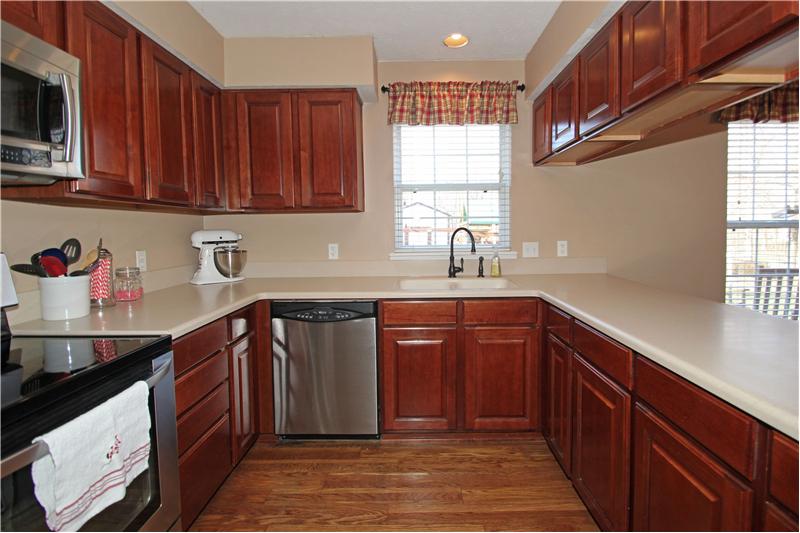 Kitchen w/new Corian counter tops and SS appliances.
