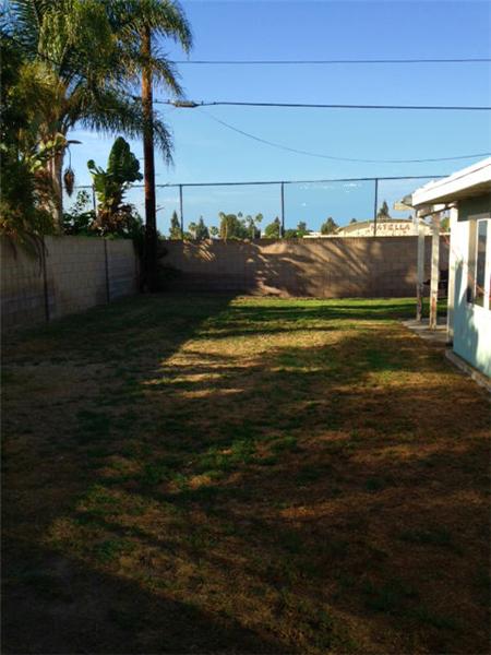 Backyard length of house looking to edge of property