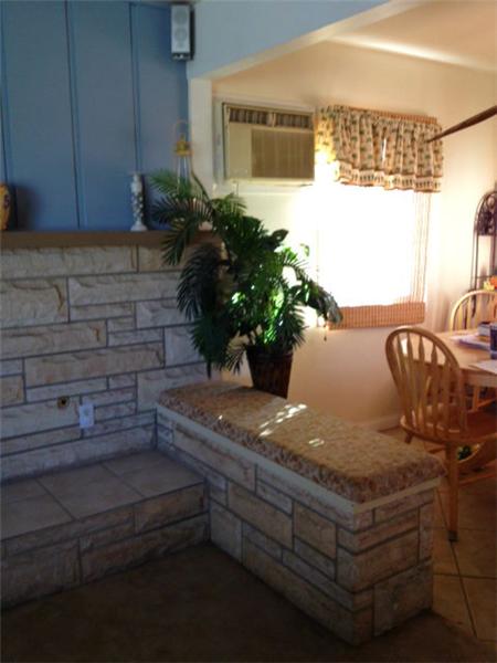 Stone bench beside fireplace