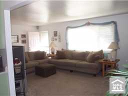 Living room has large formal window