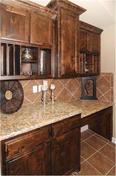 Designer cabinets in the kitchen are beautiful. Notice the built in desk.