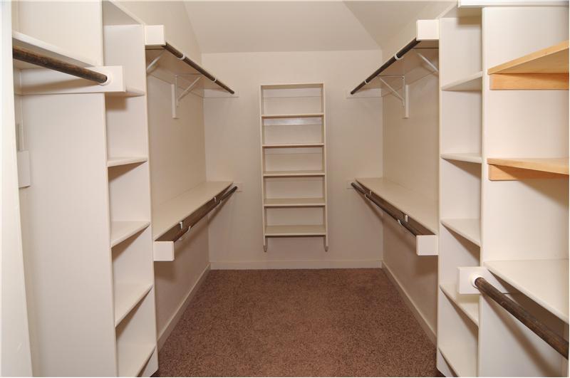 Enjoy getting ready for work or play in this HUGE master closet!