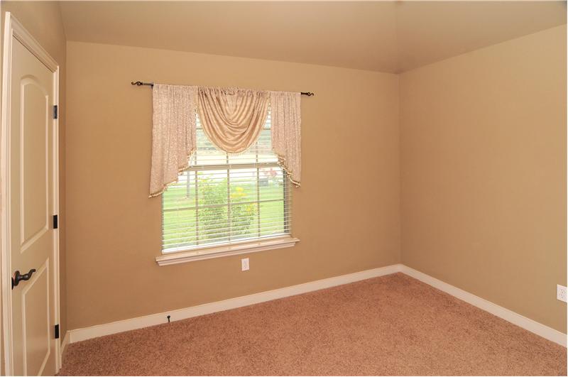 Secondary bedrooms have high-grade carpet flooring. 4th bedroom is tiled with french doors.