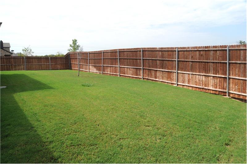 The large backyard is surrounded by an 8 foot privacy fence!