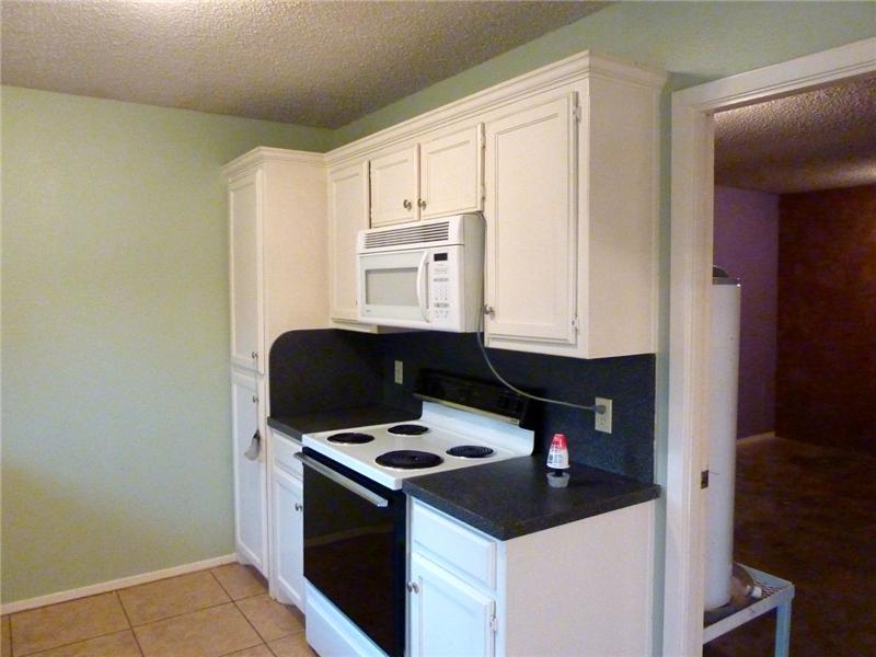 The floors are carpet and ceramic tile throughout.