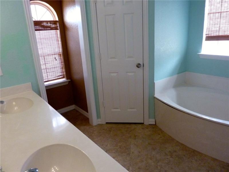 Attached to the master bedroom is the cozy master bath.