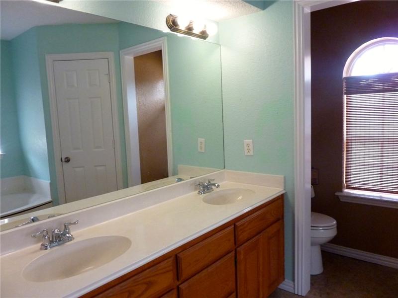 Enjoy his-and-her sinks and a huge mirror to get ready in front of.