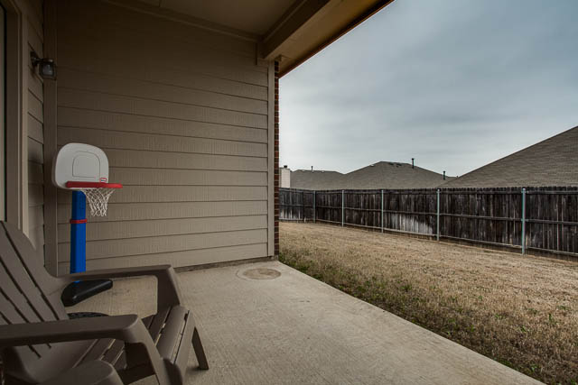 Enjoy a BBQ or morning coffee on the covered back patio.