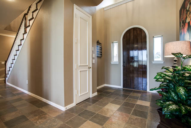 As you enter the home, fall in love with the tile floors in the entryway.