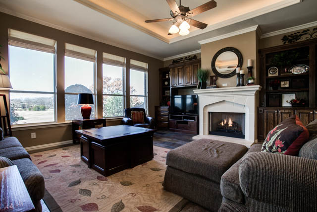 Enjoy a spacious living room with gorgeous fireplace!
