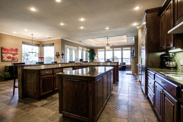 Notice the island and the granite countertops.