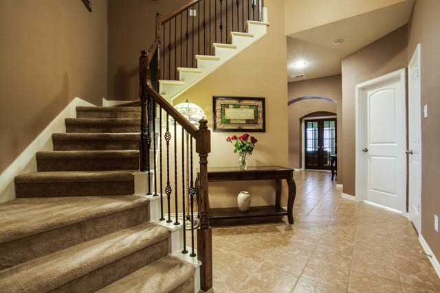 Carpet and ceramic tile flooring throughout the home.