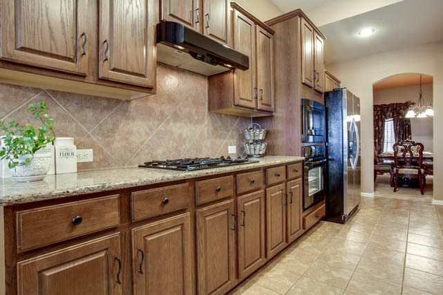 You will find plenty of cabinet space in this gourmet kitchen.