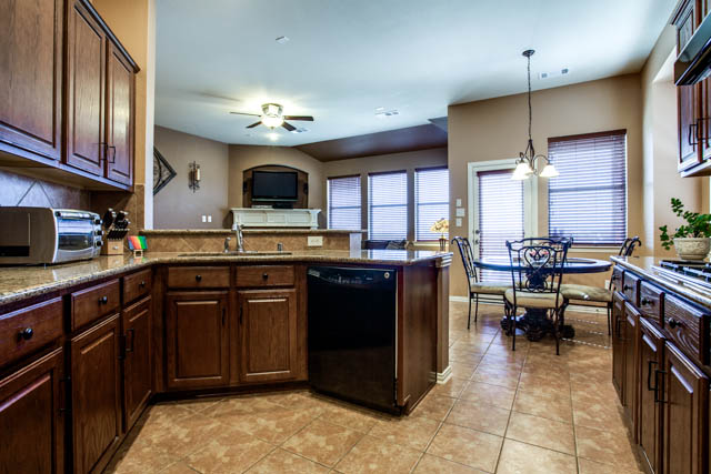 Granite countertops and GE appliances are features of this kitchen.