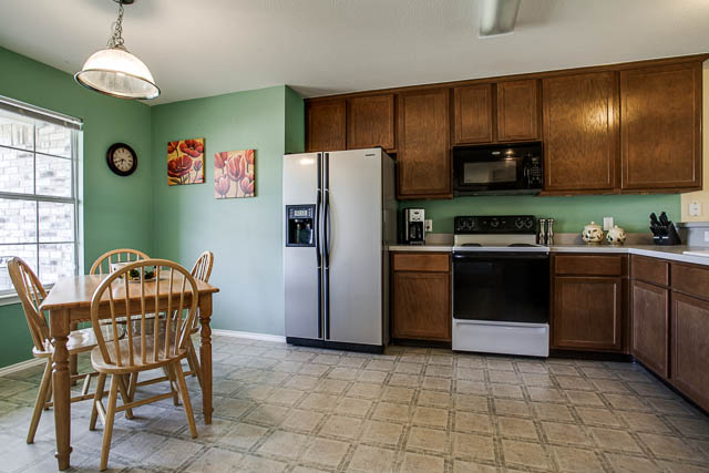 Notice the floors and large amount of cabinet space offered in the kitchen.