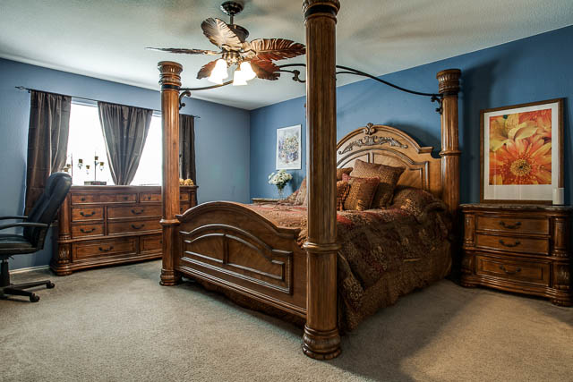 The master bedroom is split from the other bedrooms in the home for privacy and peace.