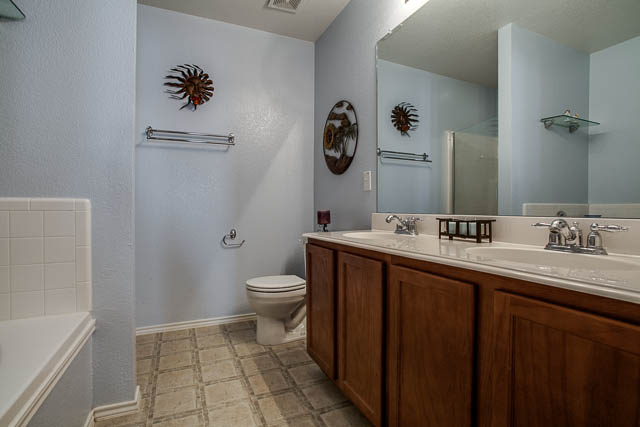 The huge master bath offers a separate bath and shower.