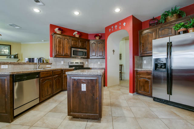 Notice the faux granite countertops and plenty of cabinet space!