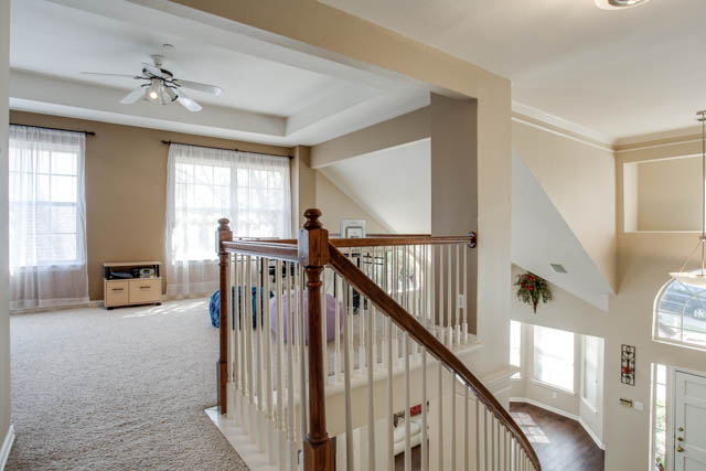 Upstairs, enjoy a third living space and all bedrooms.