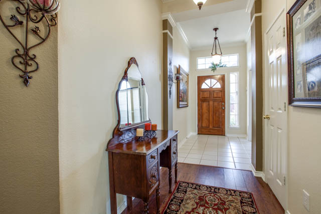 Carpet, ceramic tile, and wood flooring run throughout the home.
