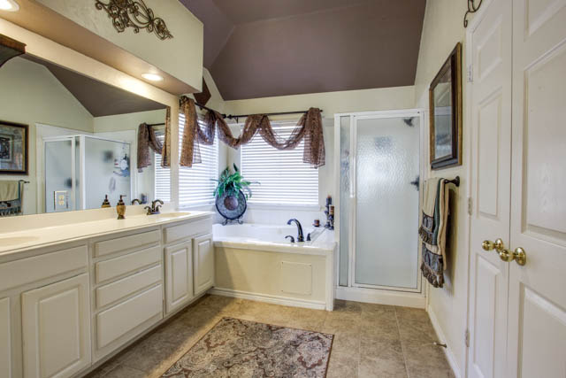 The master bath offers a jetted tub and dual sinks.