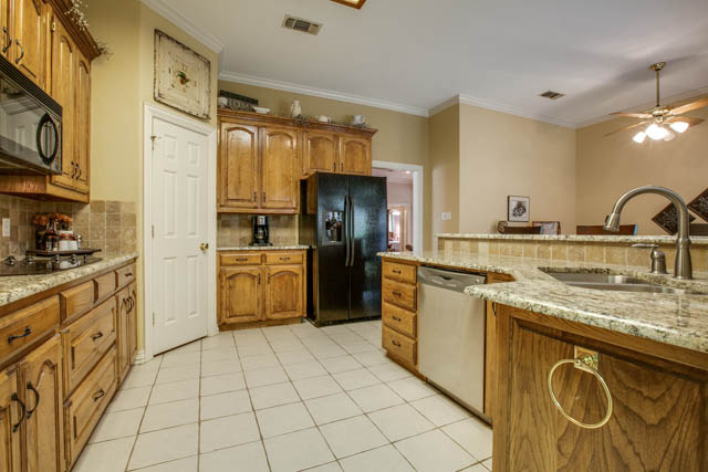The kitchen offers plenty of cabinet space.
