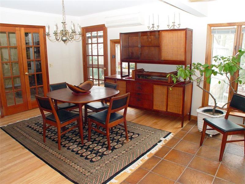 Dining Room: French door opens to Greenhouse/Sunroom with radiant-heat floor. (not shown) 