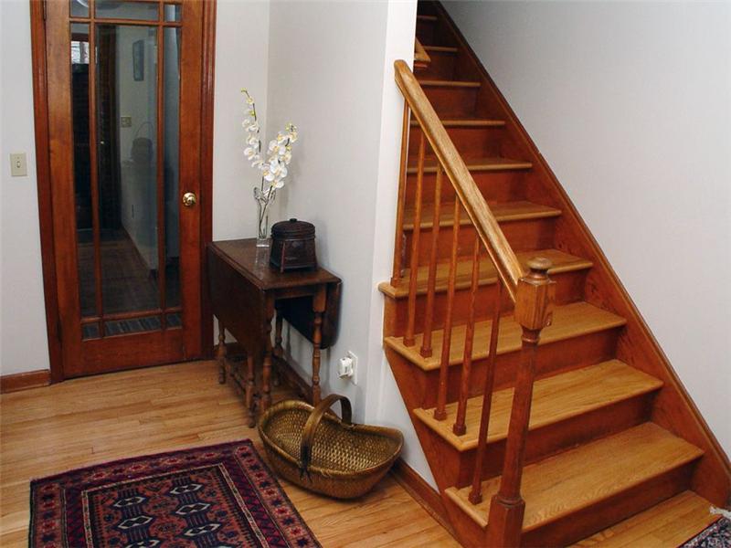 Foyer: Entry and staircase. Hardwood floors.