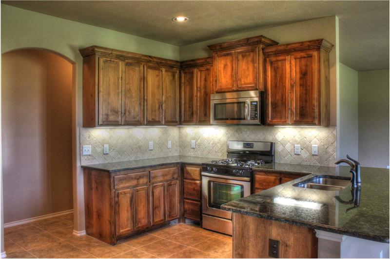 KITCHEN WITH GRANITE COUNTERS